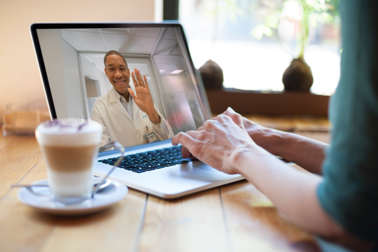 woman videochatting with doctor on a laptop