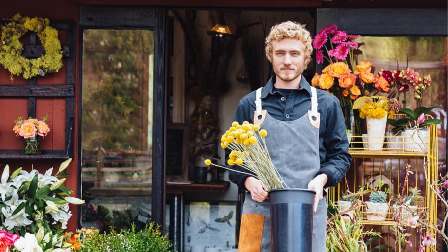 A man works at a flower shop