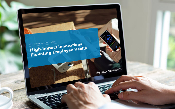 Laptop showing text which reads High-Impact Innovations Elevating Employee Health